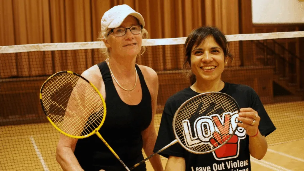 Two badminton players with their racquets